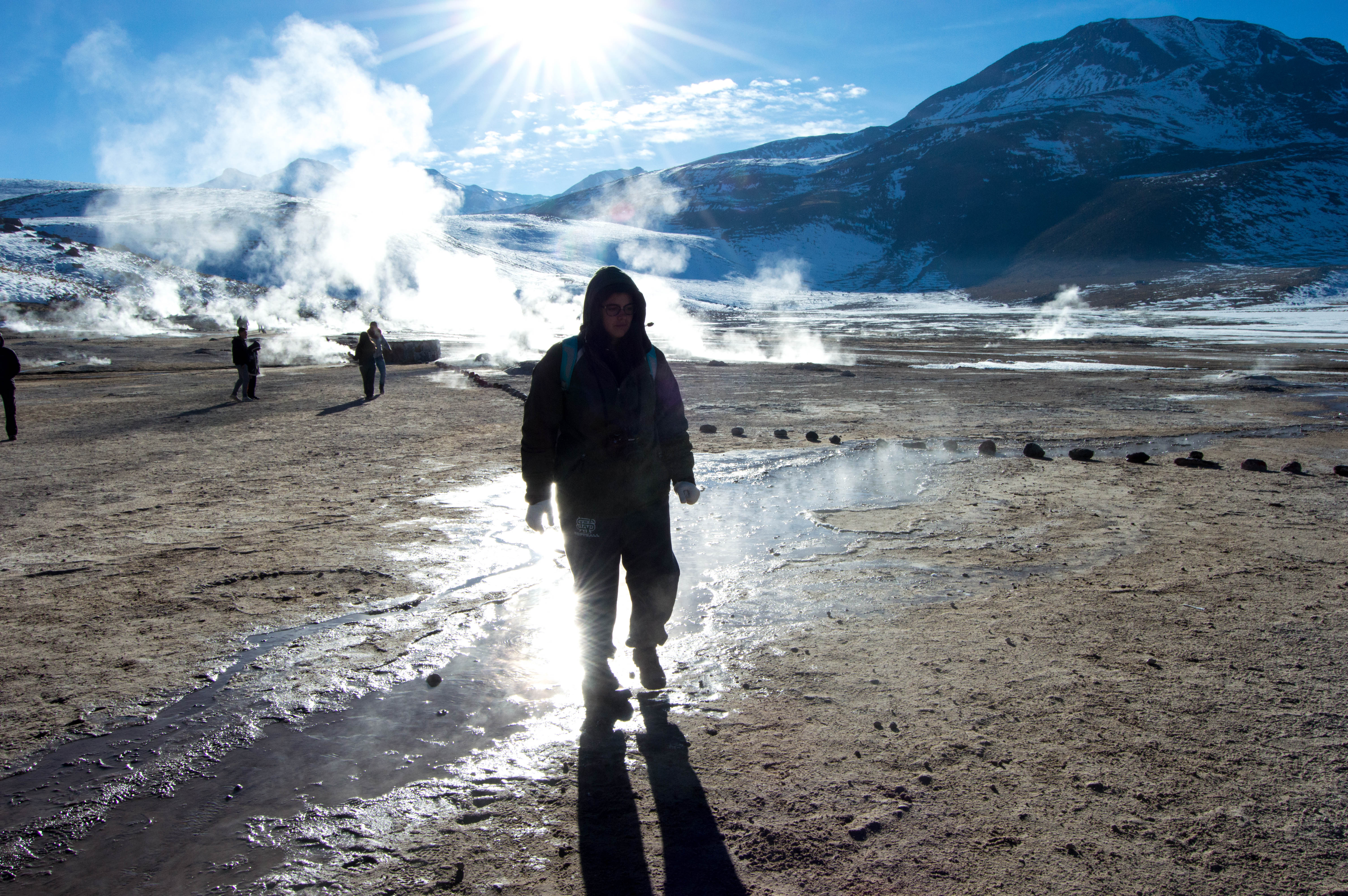 A student walks in a desert in Chile