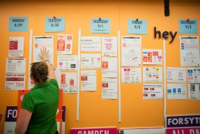 08/25/16 - BOSTON, MA. - Emily Elliott Production Specialist in the Sign Shop goes over the schedule for the start of the school year on Aug. 25, 2016. Photo by Adam Glanzman/Northeastern University