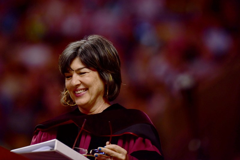 Christiane Amanpour in Commencement regalia, speaking at the podium