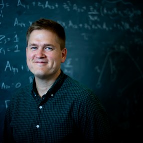 James Halverson, an assistant professor of physics at Northeastern, uses data science to study the many possibilities in string theory. Photo by Matthew Modoono/Northeastern University