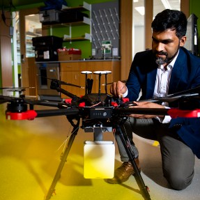 Kaushik Chowdhury, an associate professor of electrical and computer engineering, is working with former graduate student Yousof Naderi to develop technology that transforms any surface into a smart wireless charger to power several devices simultaneously. This system can also be used to power more complex gadgets, such as airborne drones. Photo by Ruby Wallau/Northeastern University