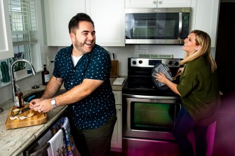 Northeastern graduates Kenzie Swanhart and Julien Levesquev say that their culinary partnership was built in the kitchen of a small apartment in Boston’s Fenway neighborhood. Now the duo is about to release The New Newlywed Cookbook: 100 Recipes for Every Couple to Cook Together to unite people through the joys of cooking and eating. Photo by Ruby Wallau/Northeastern University