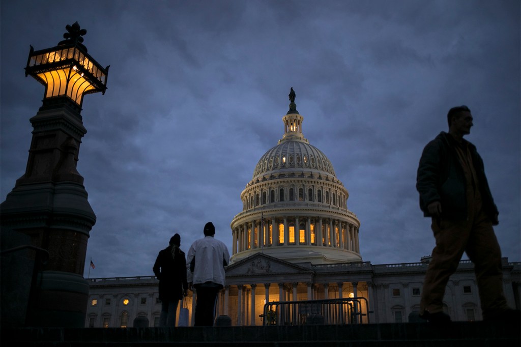 Lights illuminate the U.S. Capitol on Jan. 21, 2018. The budget deficit—the gap between what the government spends and what it takes in through taxes and other sources of revenue—is expected to reach $960 billion for this fiscal year, which ends on Sept. 30. The deficit will widen to $1 trillion by fiscal year 2020. AP Photo/J. Scott Applewhite