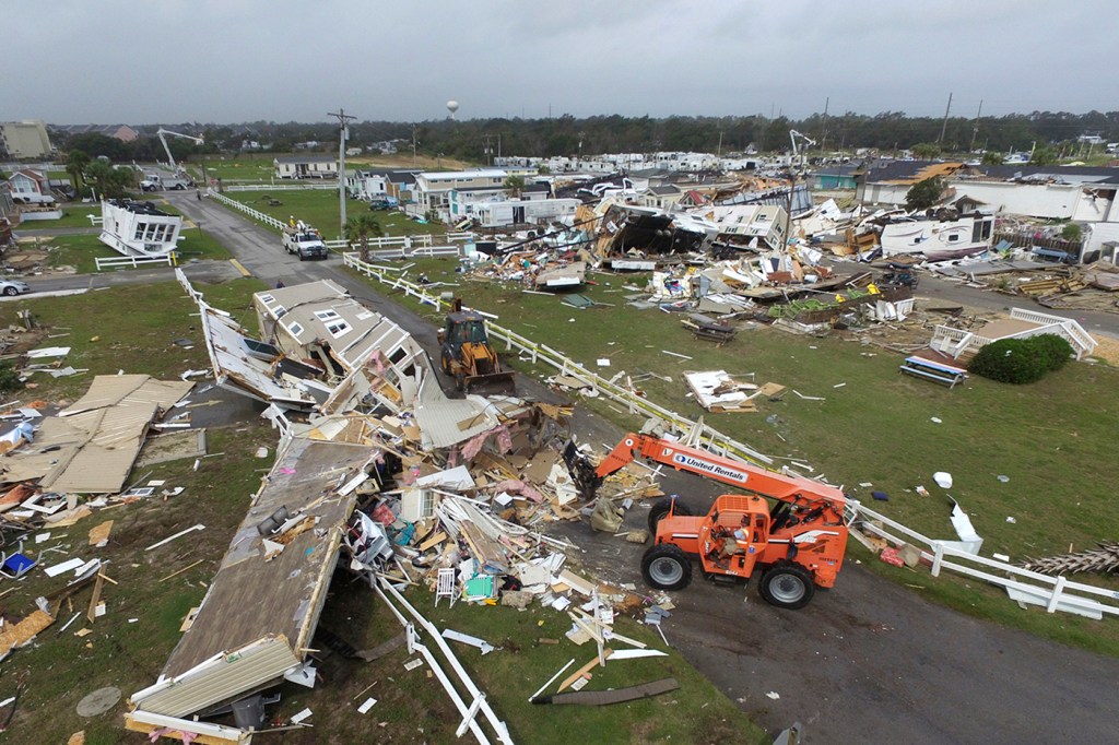 Town employees of Emerald Isle work to clear the road after a tornado hit the beach town in North Carolina as Hurricane Dorian moved up the East coast on Thursday, Sept. 5, 2019. AP Photo/Tom Copeland