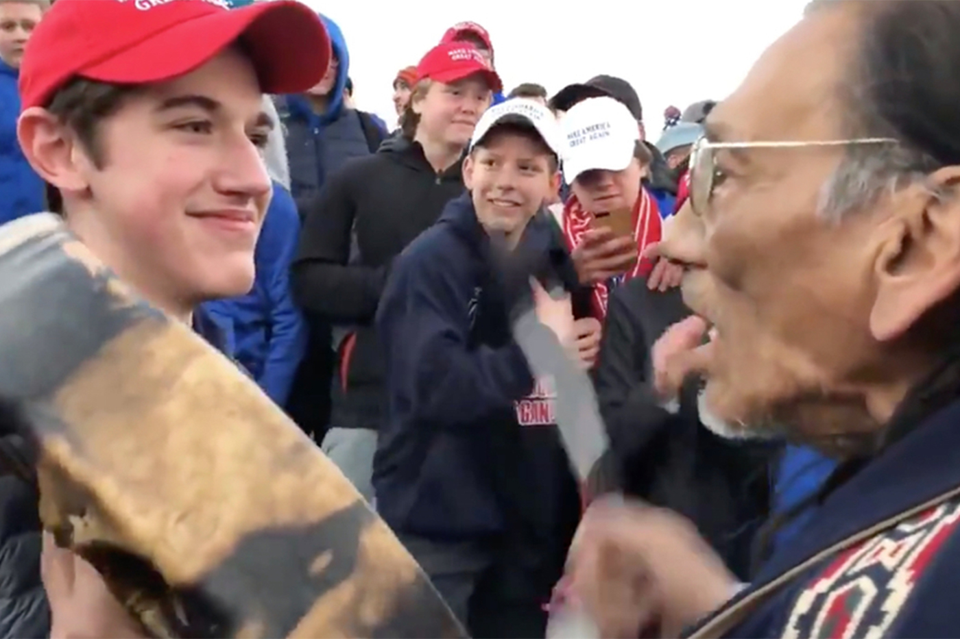 Teenager in MAGA hat