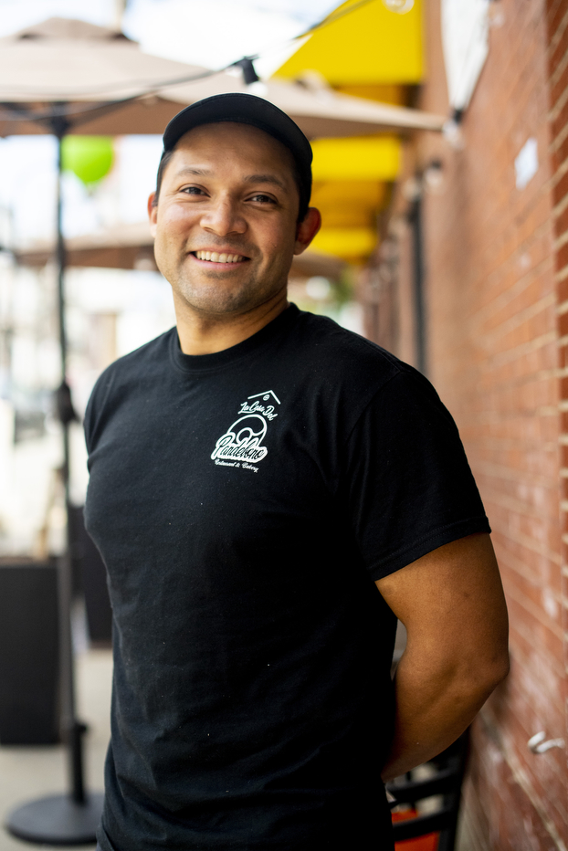 Fernando Rosas stands outside his bakery.