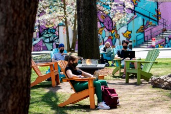 Student sitting on a chair outdoors