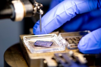 Close-up of a semiconductor chip in Matteo Rinaldi's lab. Rinaldi is a professor of electrical and computer engineering.