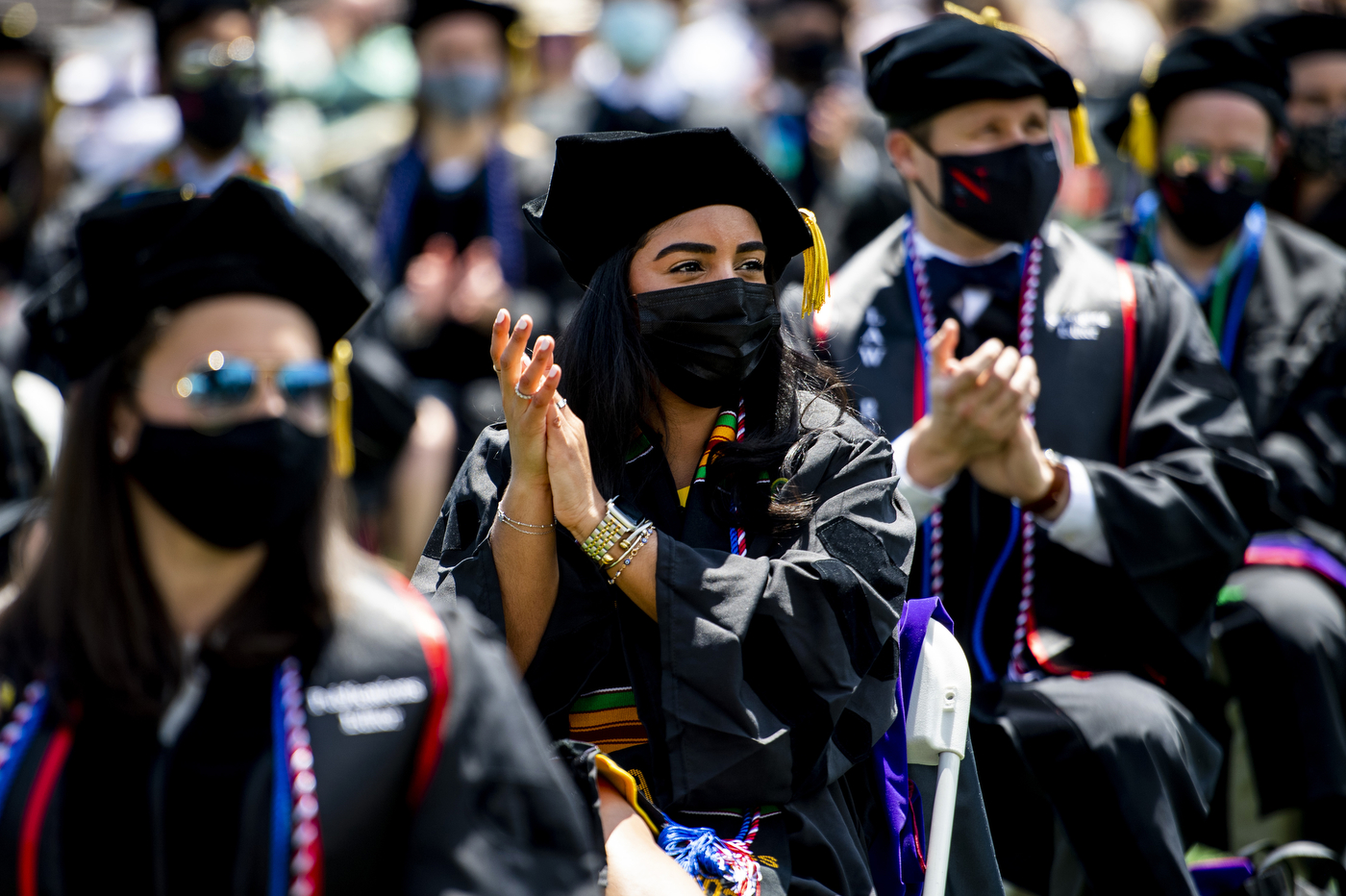 Graduate students clapping