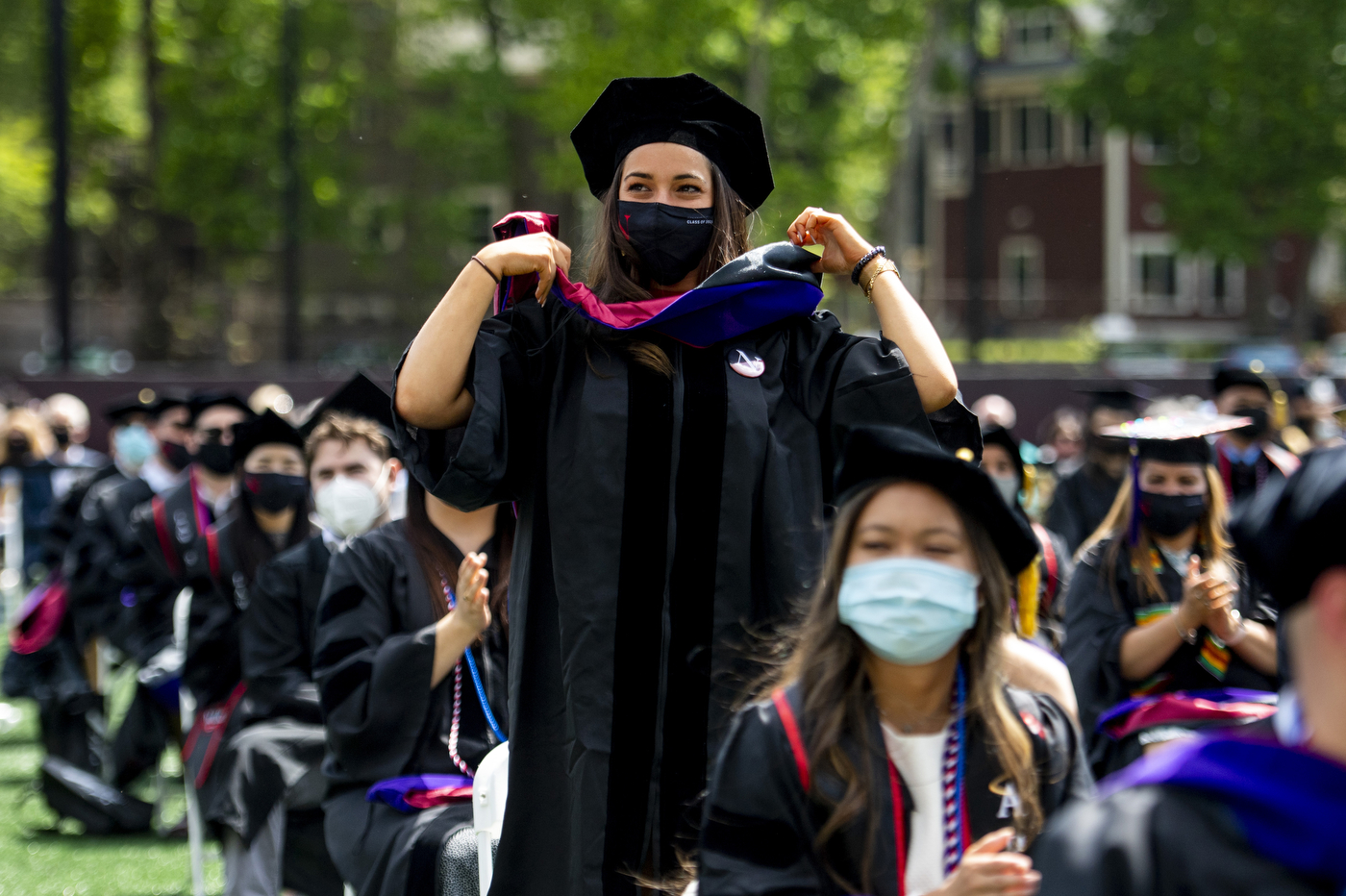 Student standing in cap and gown