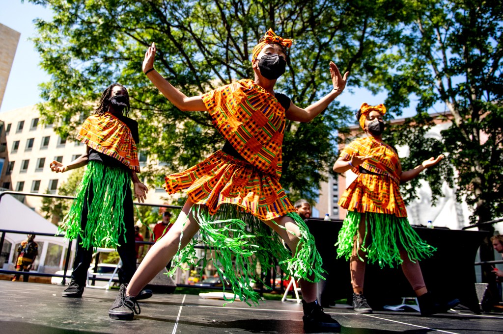 Members of the OrigiNation Cultural Arts Center perform on Centennial Common. Photo by Matthew Modoono/Northeastern University