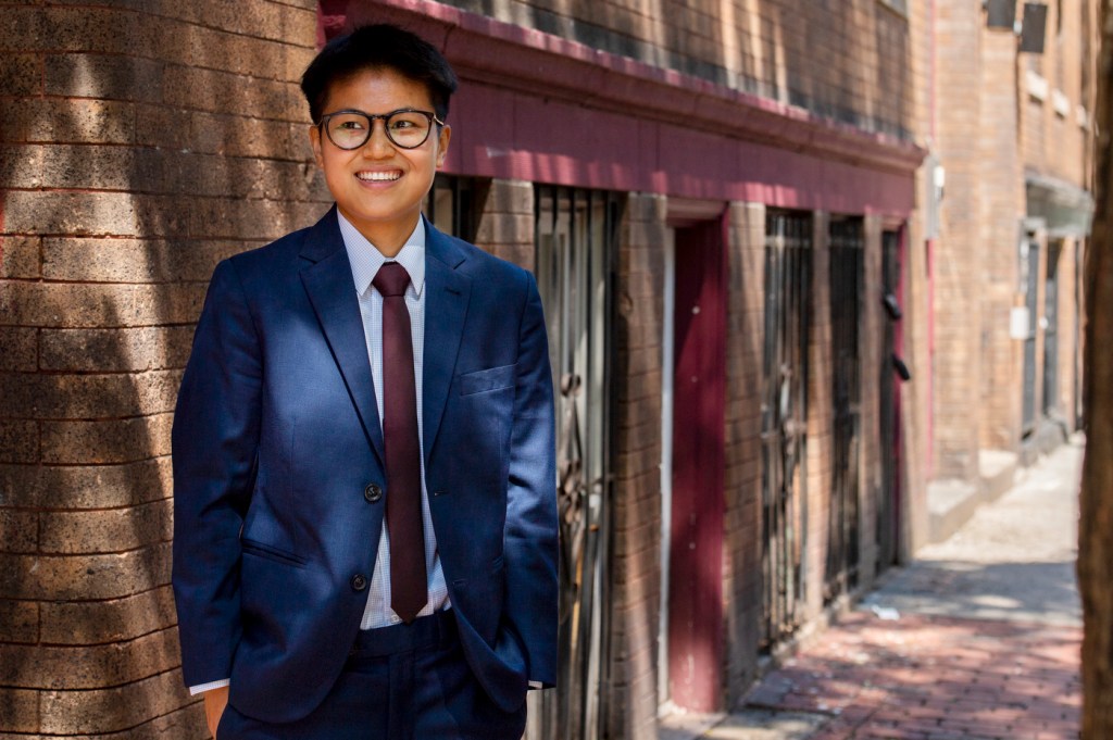 School of Law graduate Lucie Gulino poses on a street in Boston.