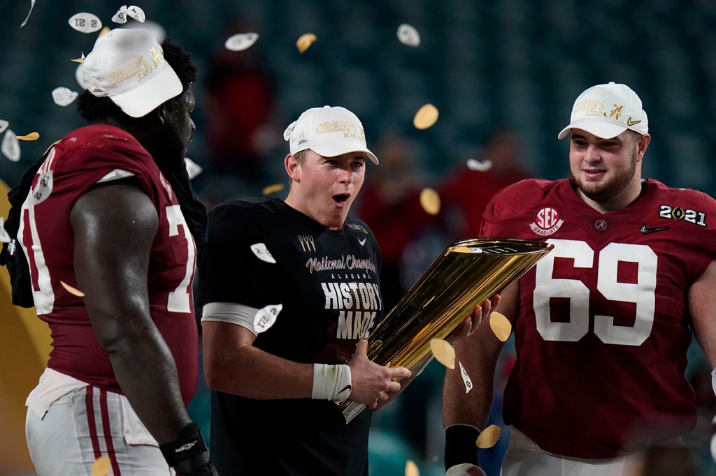 Alabama football players celebrate their national championship in 2021.