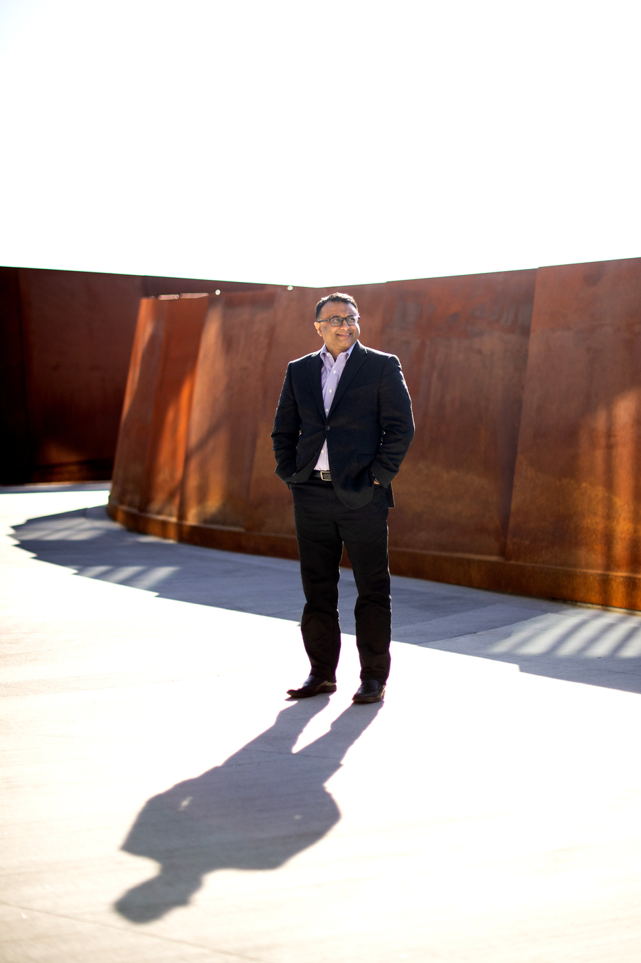 Neil Maniar stands on the pedestrian bridge at Northeastern.