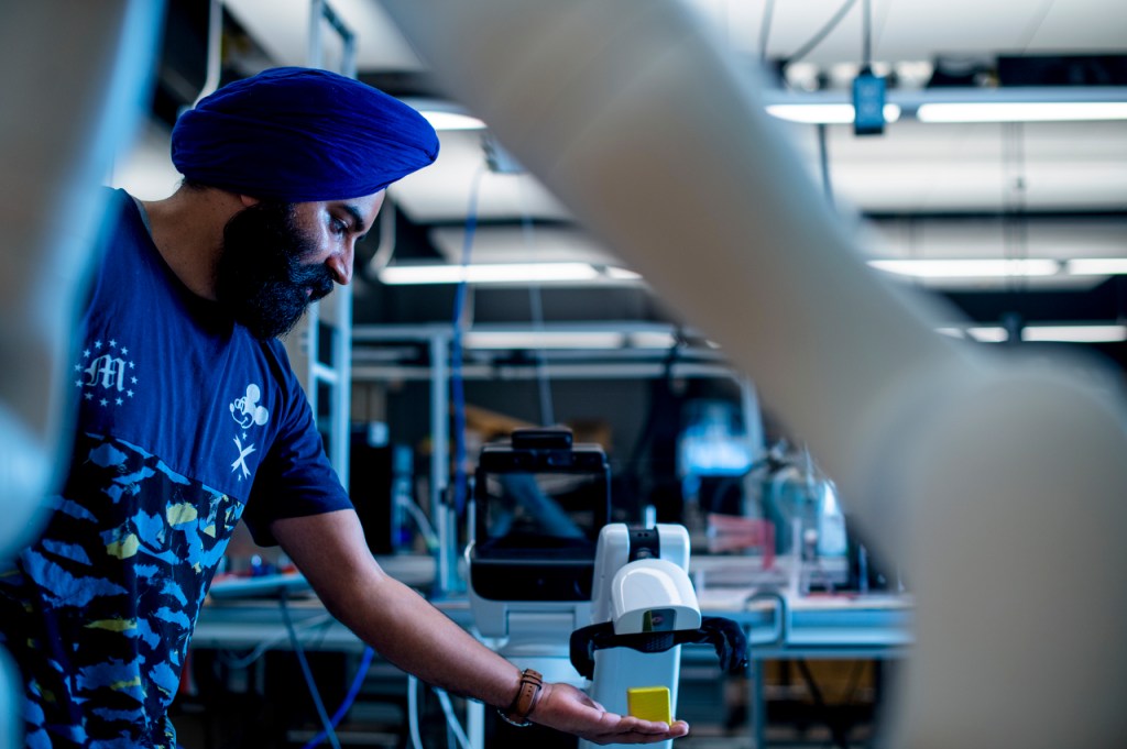 Man working in a robotics lab