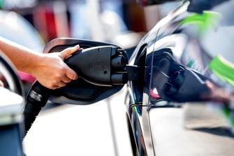 Person charging an electric car