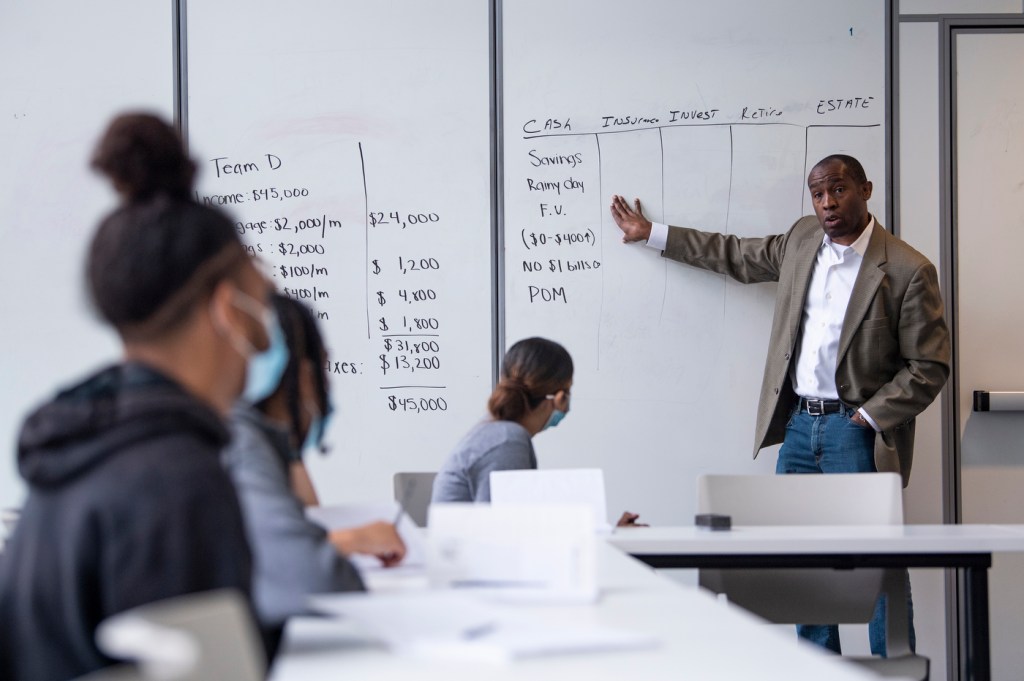 Nicholas Josey leads a class in financial literacy.