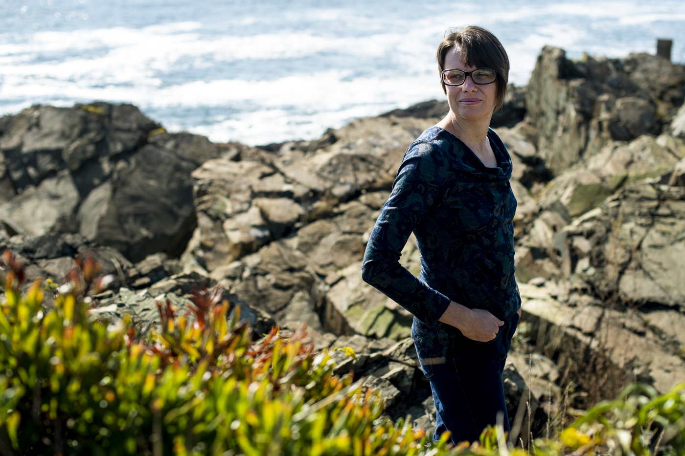 katie lotterhos posing outside in front of rocks in nahant