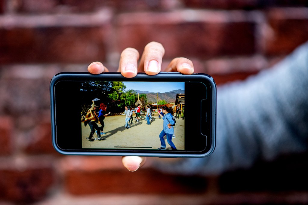 an iphone displaying a scene from the dialogues of civilization program