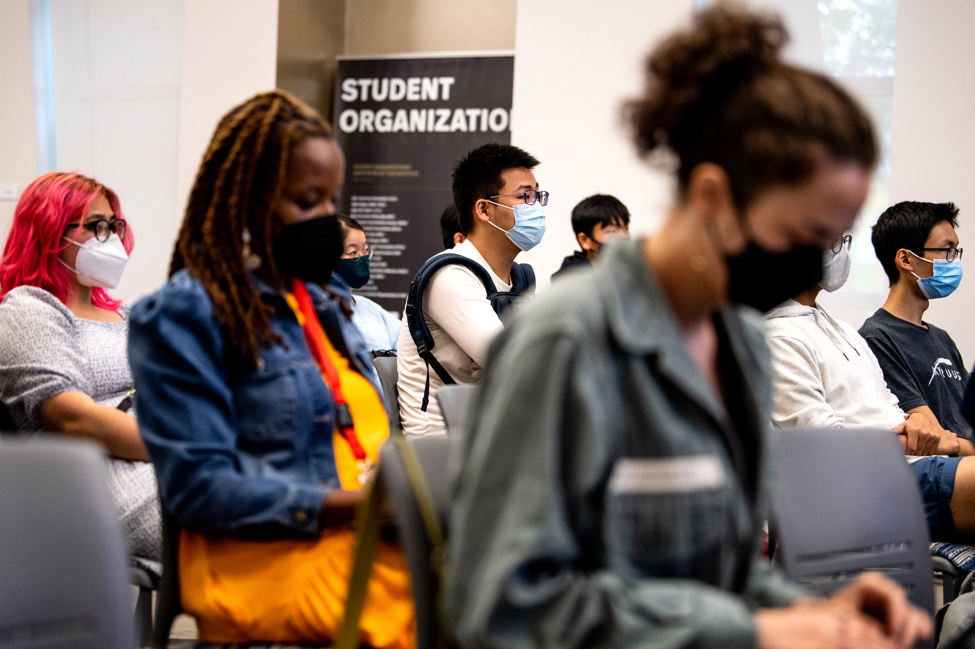 masked attendees at the asian american and the world lecture