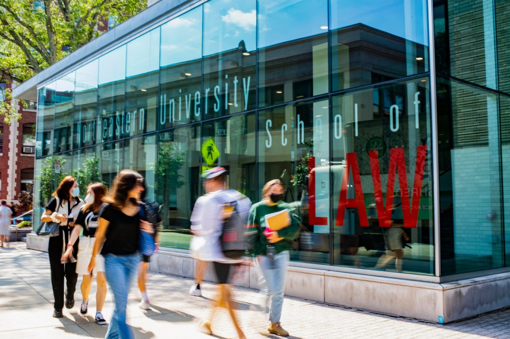 students walk by northeastern’s top rated law school