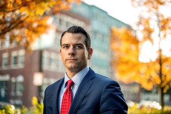 man wearing suit and red tie