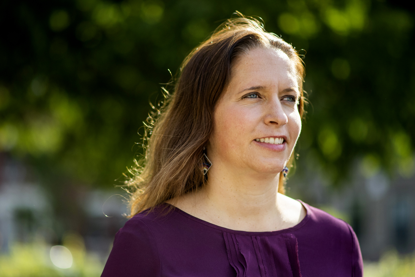 jennie stephens smiling outside wearing purple shirt 