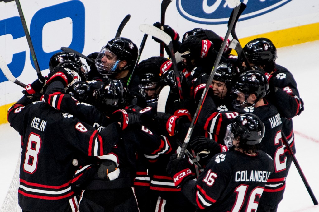 Huskies celebrate their semifinal win over Boston College in 2022 Beanpot.