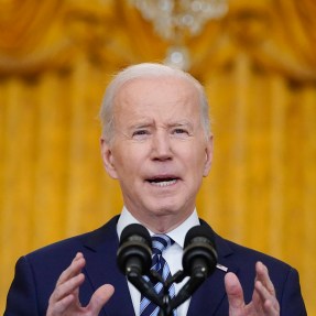 president joe biden speaking at a podium