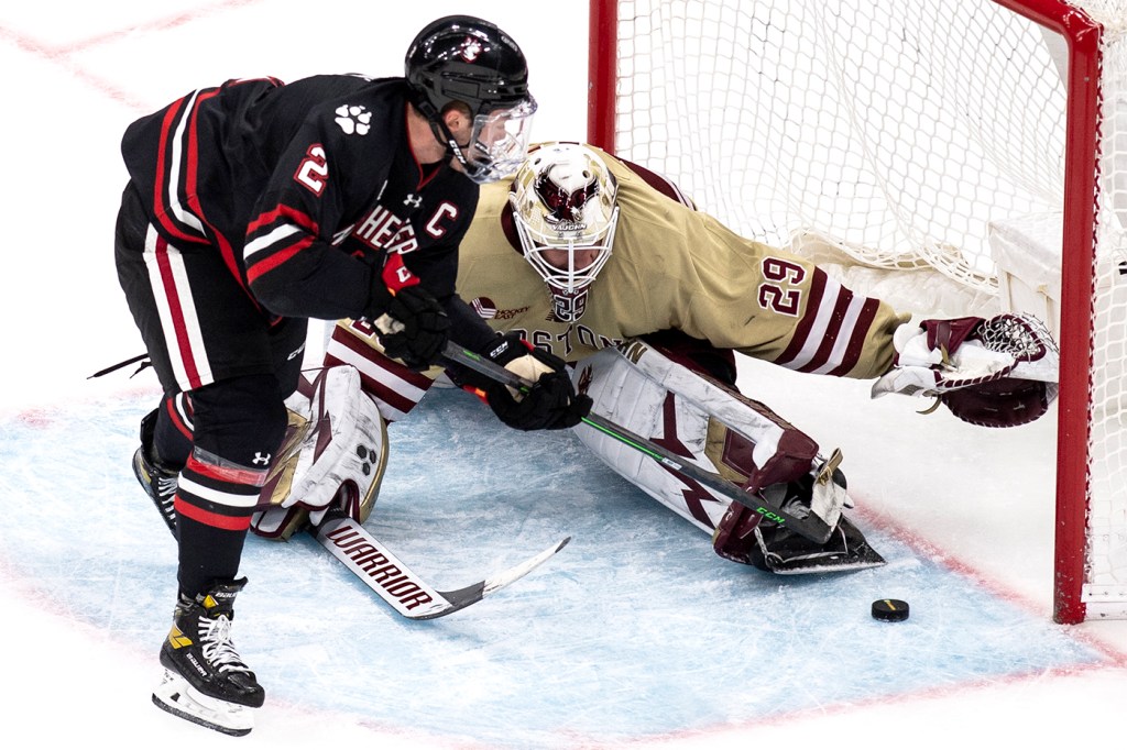 Northeastern team captain and top defenseman Jordan Harris attacks the net.