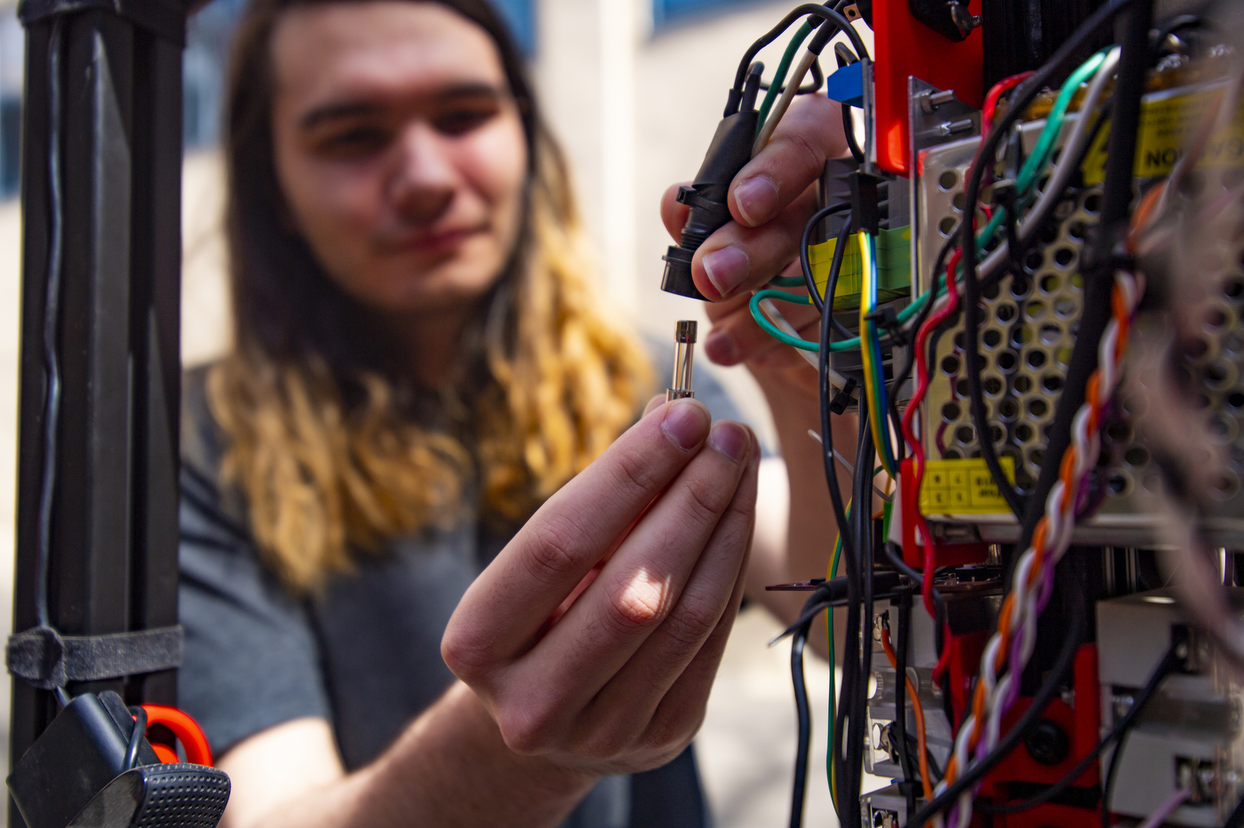 Ethan connects a wire and a plug