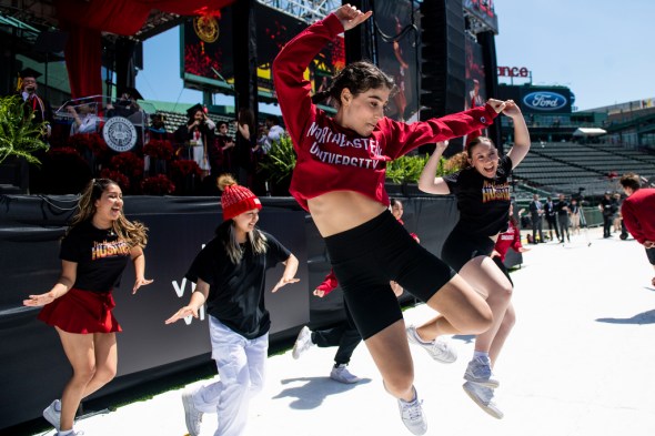 members of northeasterns dance team jumping in the air