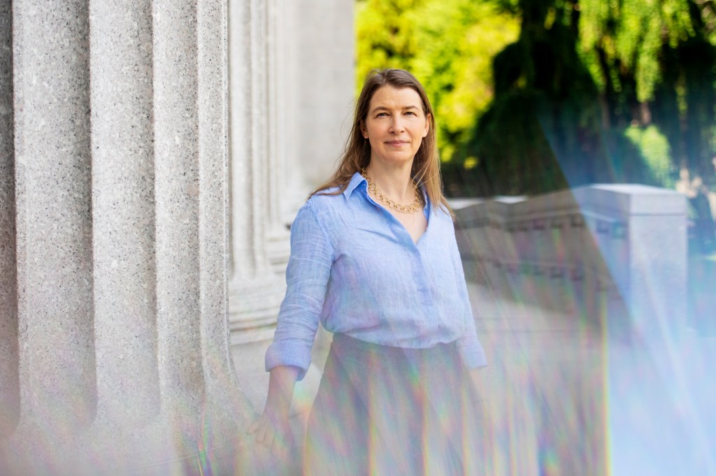 woman standing outside with blue button down