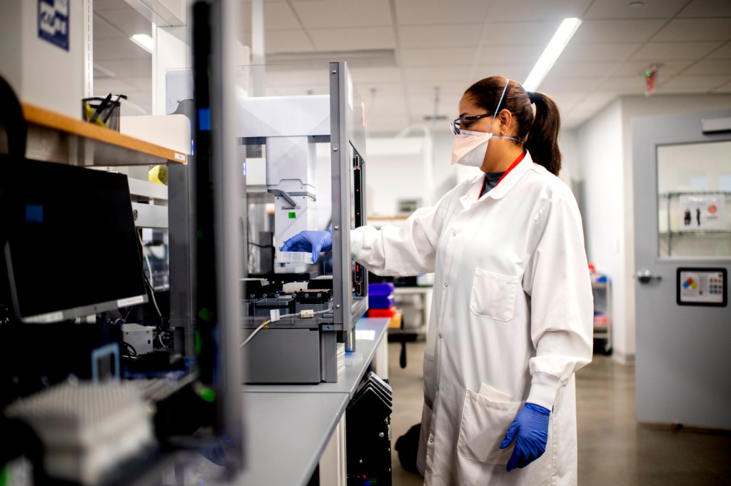 woman wearing white lab coat in a lab