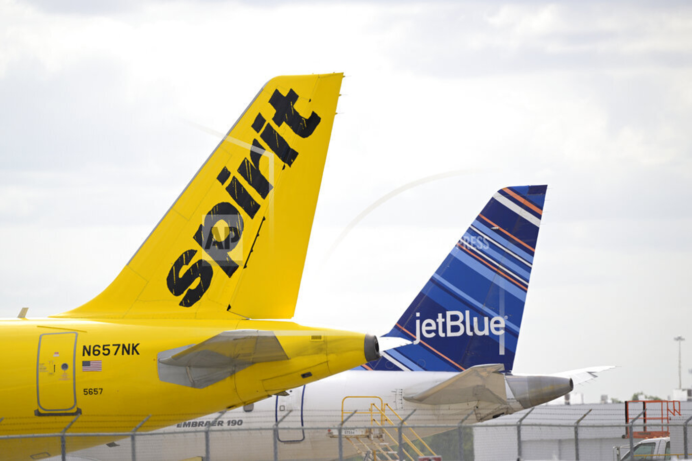 Spirit and Jet Blue planes parked next to each other