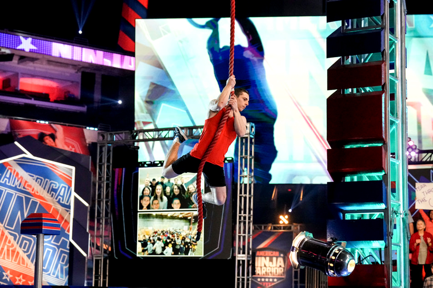 Josh swinging on a rope on set