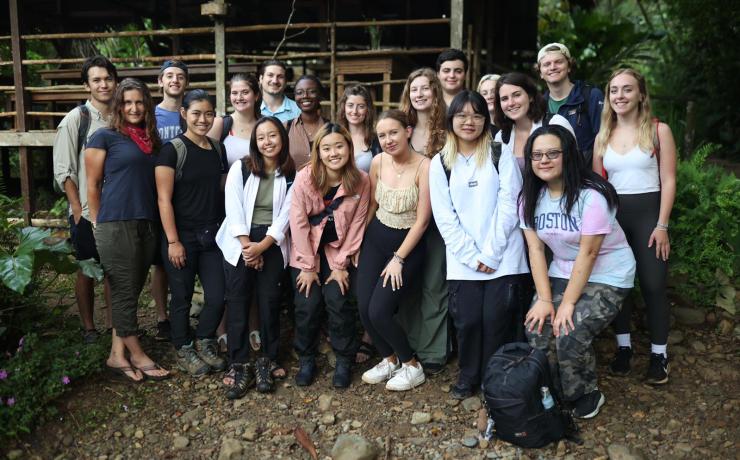 group of students standing outside smiling