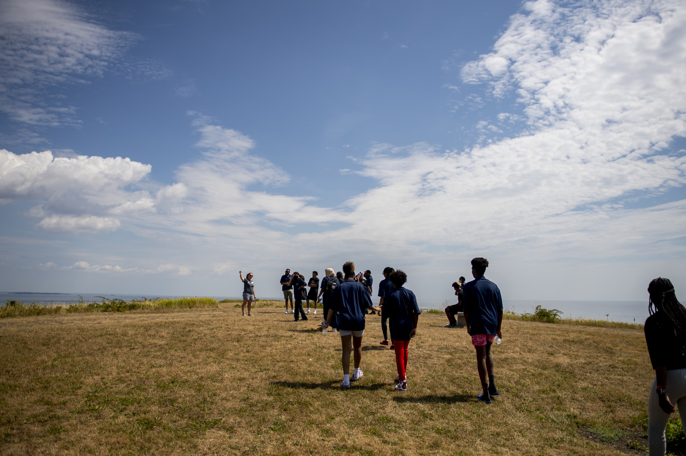 Kids on the hill, under the blue sky