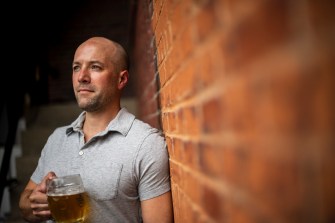 Northeastern food and world history professor Malcolm Purinton poses for a portrait at Sam Adams Brewery in Jamaica Plain.