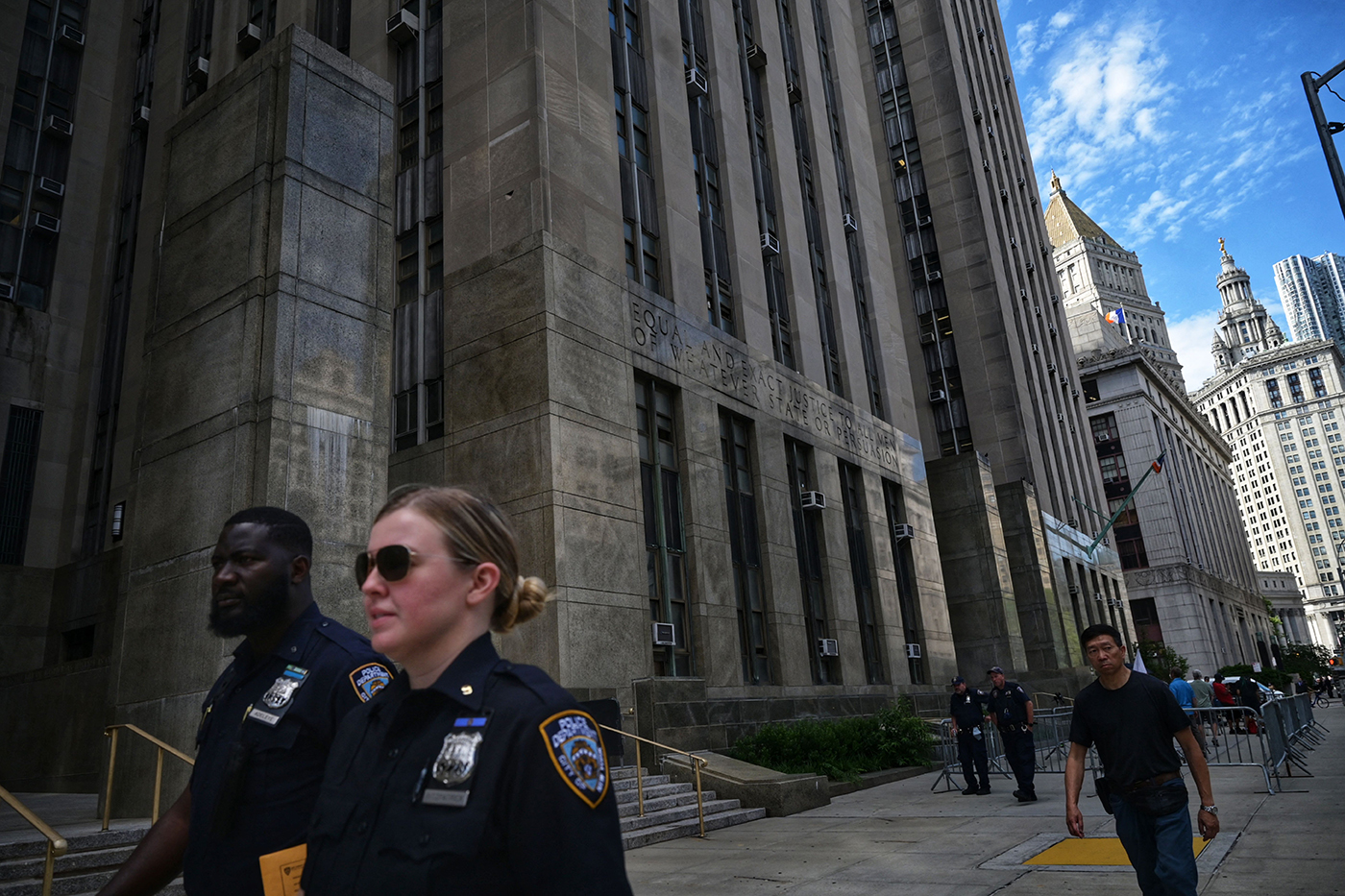 Police walking outside a city courthouse