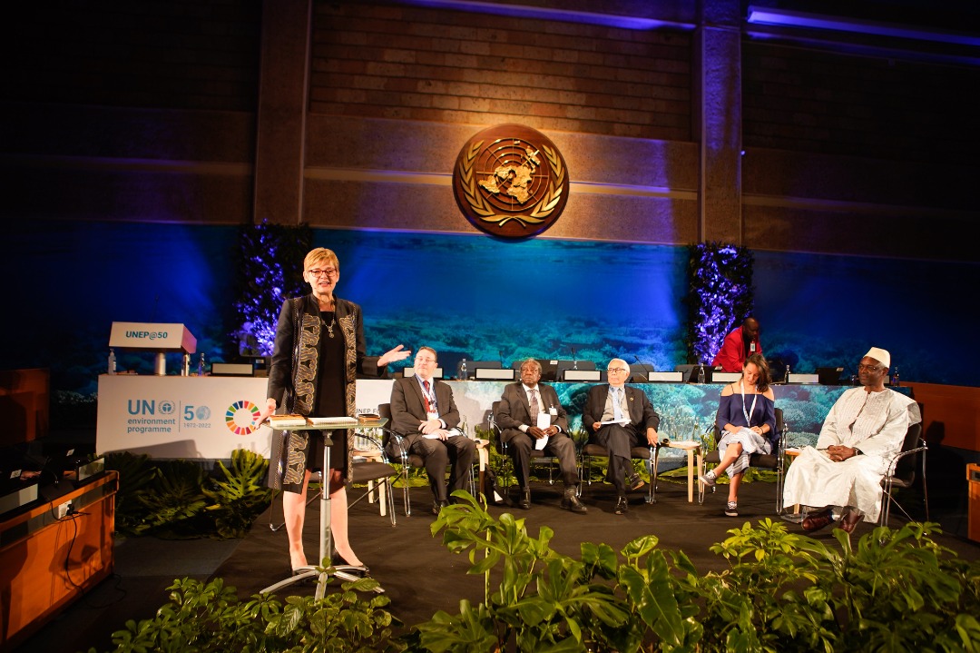 Woman speaking at podium. 