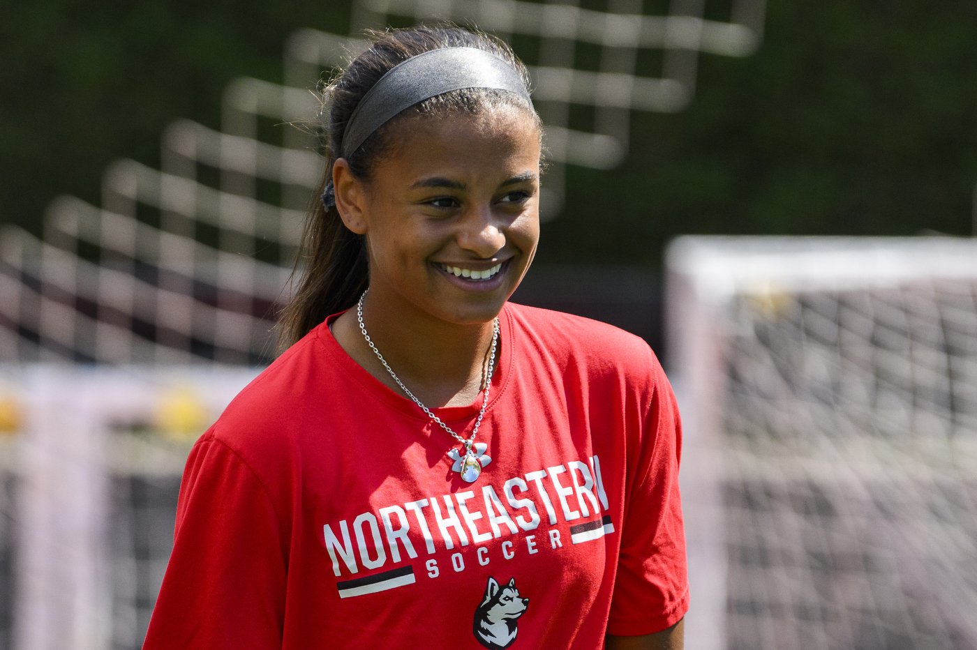 Katherine Marchesseault smiles on a soccer field