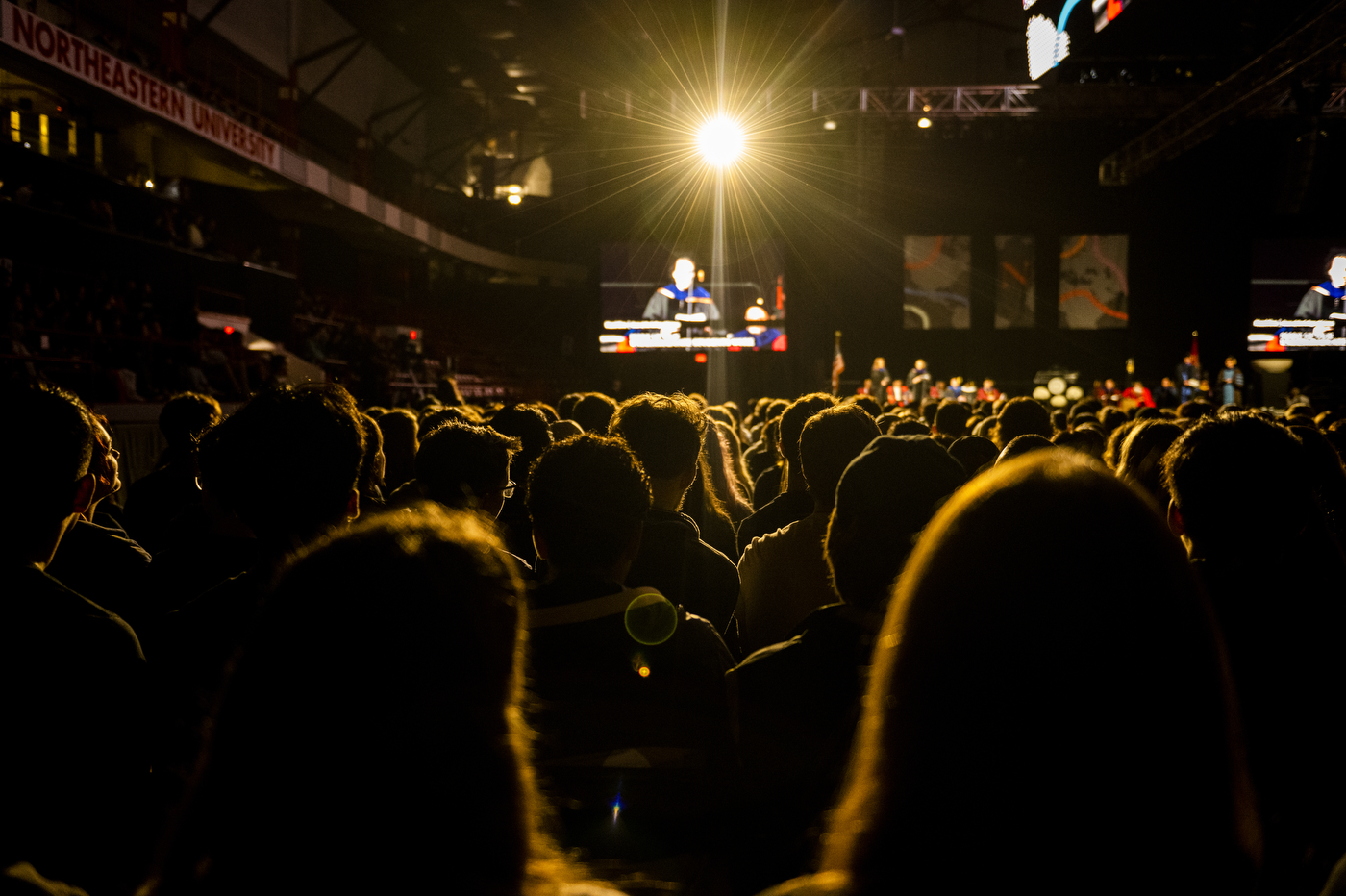 People stand together in a large crowd at Northeastern's 2022 Convocation.