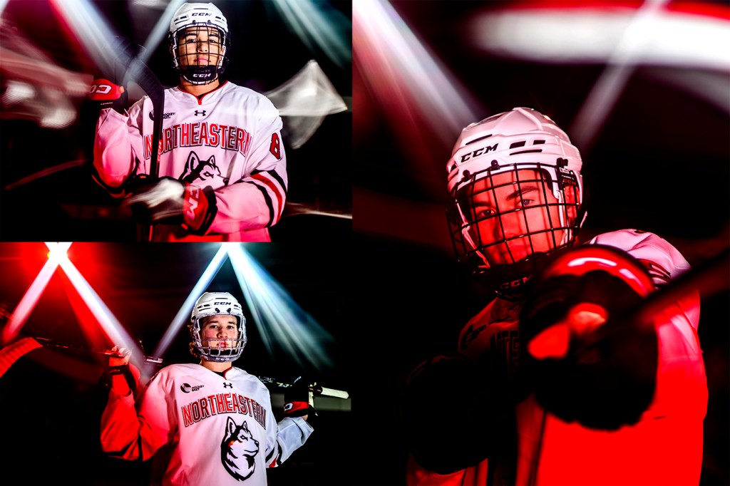 Three hockey players wear hockey gear and hold sticks