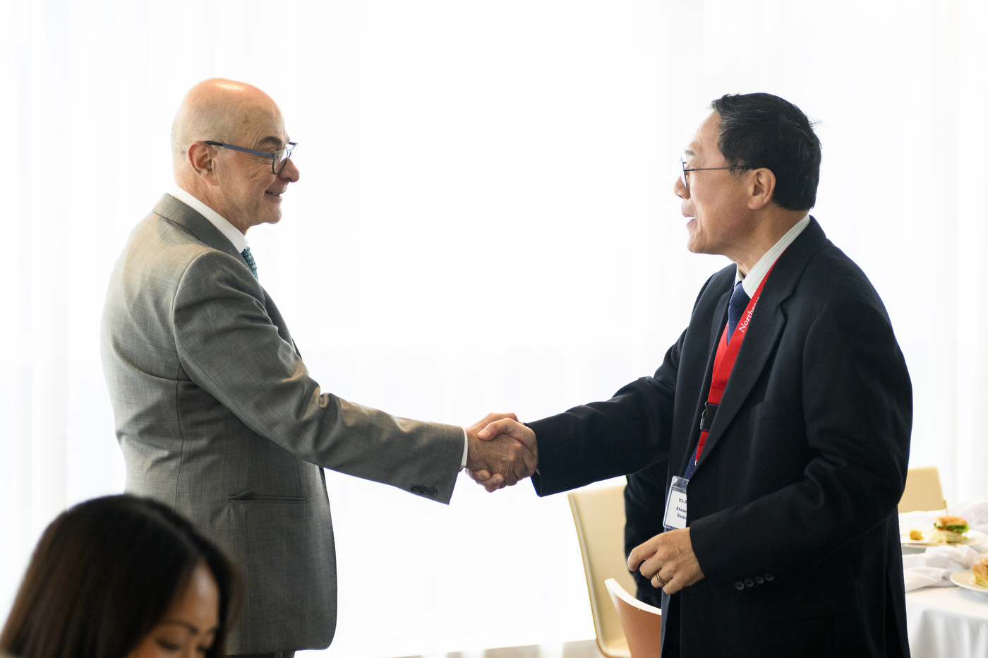 President Aoun shaking a CCADP member's hand