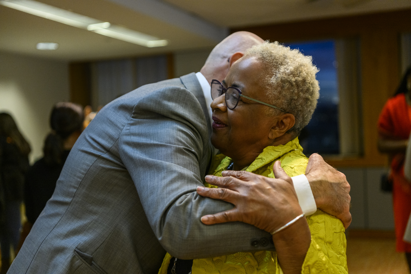 Margaret Burnham hugs Joseph Aoun