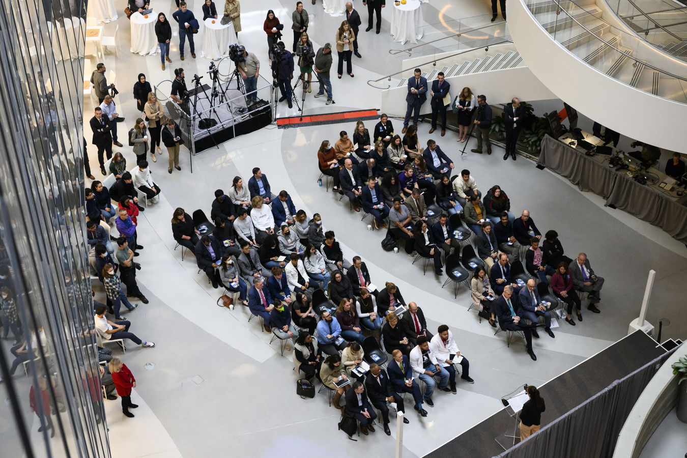 A large crowd of people in a brightly lit room to celebrate STEM Week 2022.