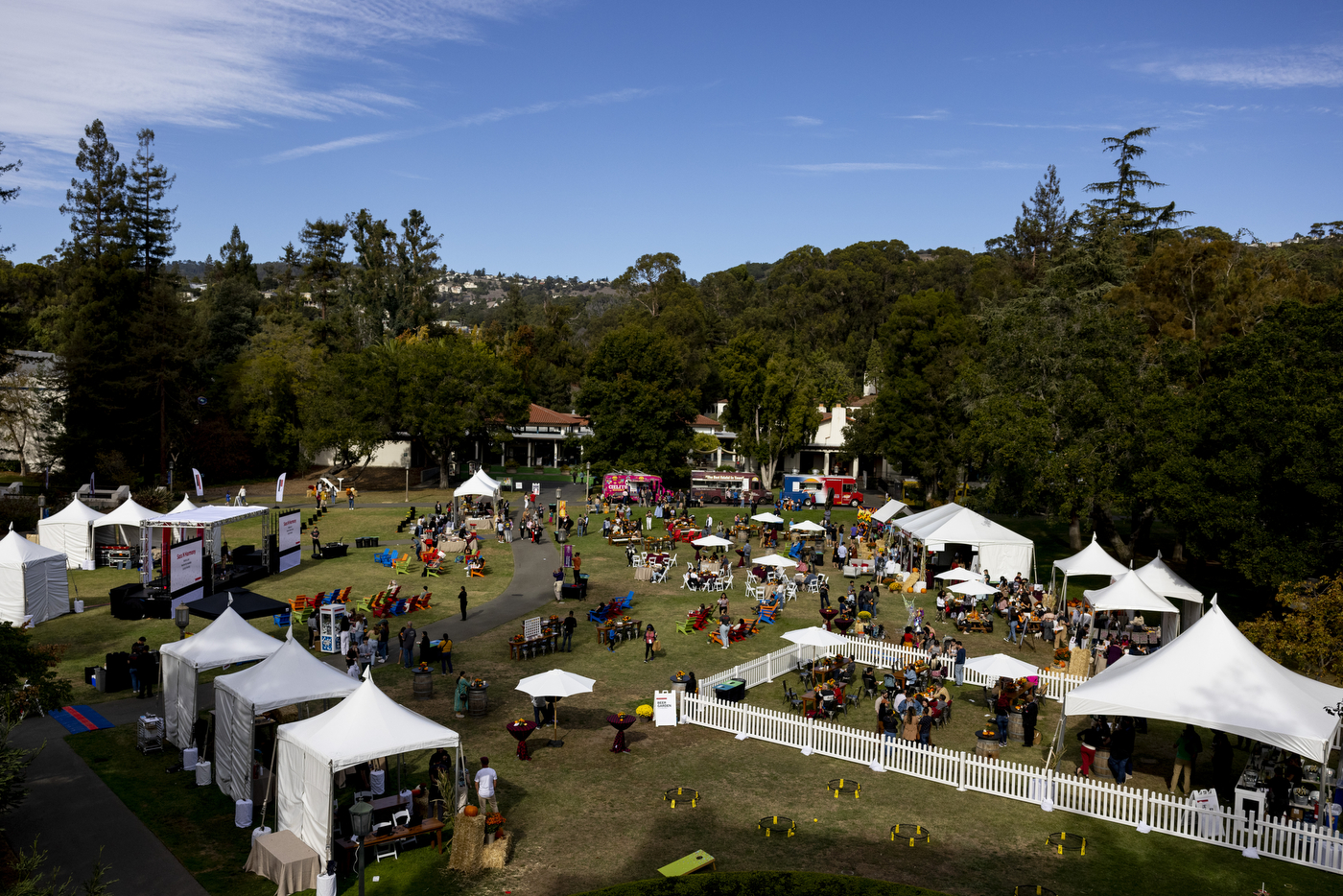 an aerial view of an outdoor festival with tents