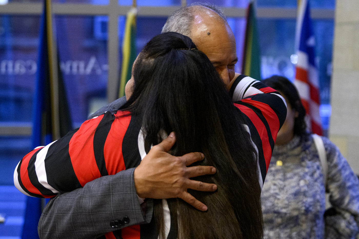 man and woman hugging