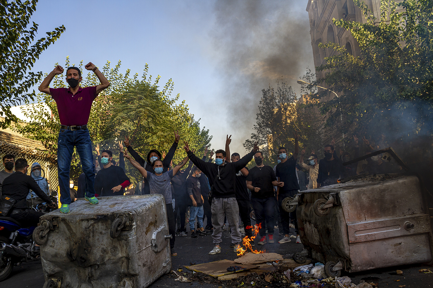 Iranian protests in action; people gesturing in union